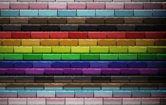 brick wall painted in colour of pride/LGBTQ flag colours