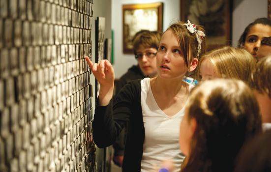 Students gathered around a display at the National Holocaust Centre and Museum