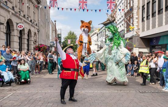Street Fest in Gloucester on 1 July 2023. Giant puppet Farrah the Fox parades the streets with Sabrina, a puppet representing the Spirit of the River Severn, created in partnership with Emergency Exit Arts. 