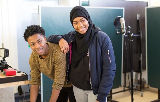Two young people in a recording studio