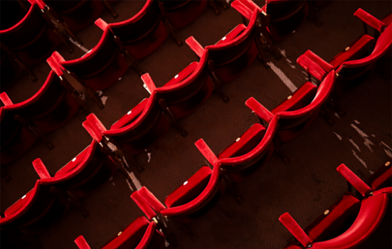 Bird's eye view of unoccupied red theatre seating
