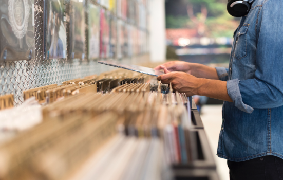 man browses record store