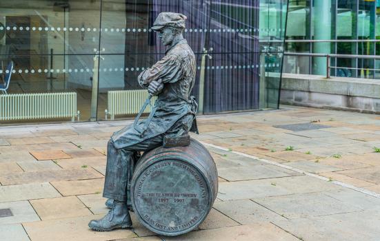 A sculpture of The Ulster Brewer or Barrel Man 1997 By Ross Wilson