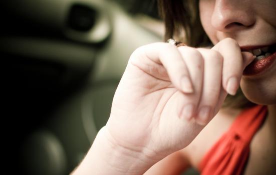 Photo of person biting nails