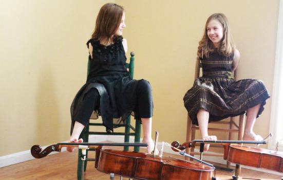 two girls playing the Cello