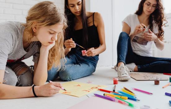Young women are taking part in an art session together