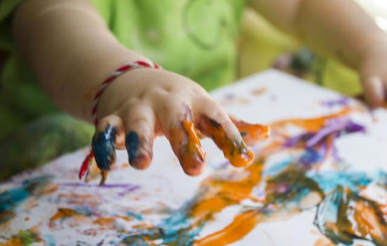 Photo of a child finger painting
