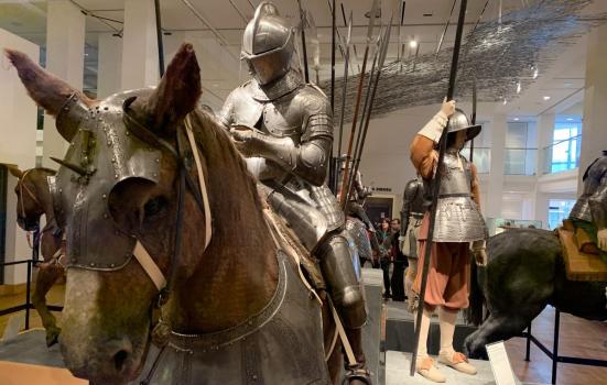 A mannequin in armour sitting on a fake horse at the Royal Armouries Museum, Leeds
