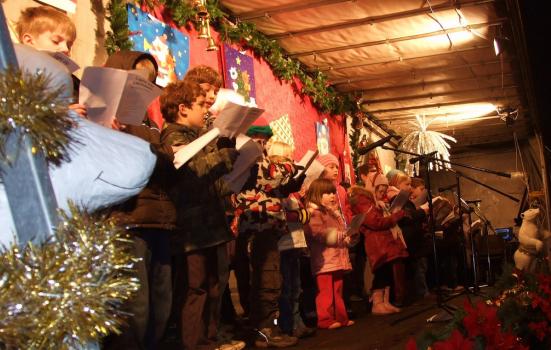 A school choir sings at a Christmas event