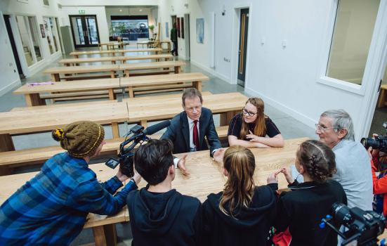 Photo of Nicholas Serota being interviewed by students 