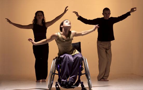 Photo of three dancers - one in a wheelchair