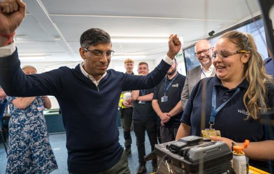 Prime Minister Rishi Sunak cheering at a training academy