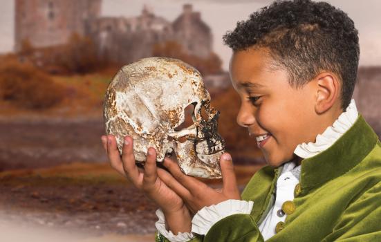 Photo of boy holding a skull