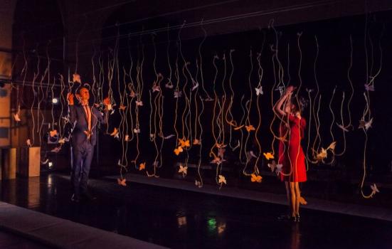 Picture from a show called The Life & Loves of a Nobody, which toured in 2014, in which performers pull on some of the strings suspending white paper butterflies and they all bounce off and fall to the ground.