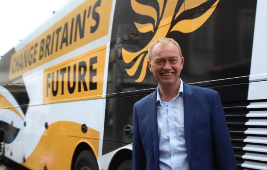 Photo of Tim Farron in front of campaign bus