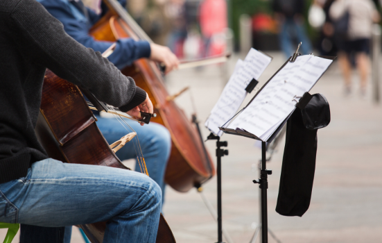 Two cellists performing in public