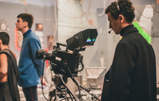 A young producer works on film set